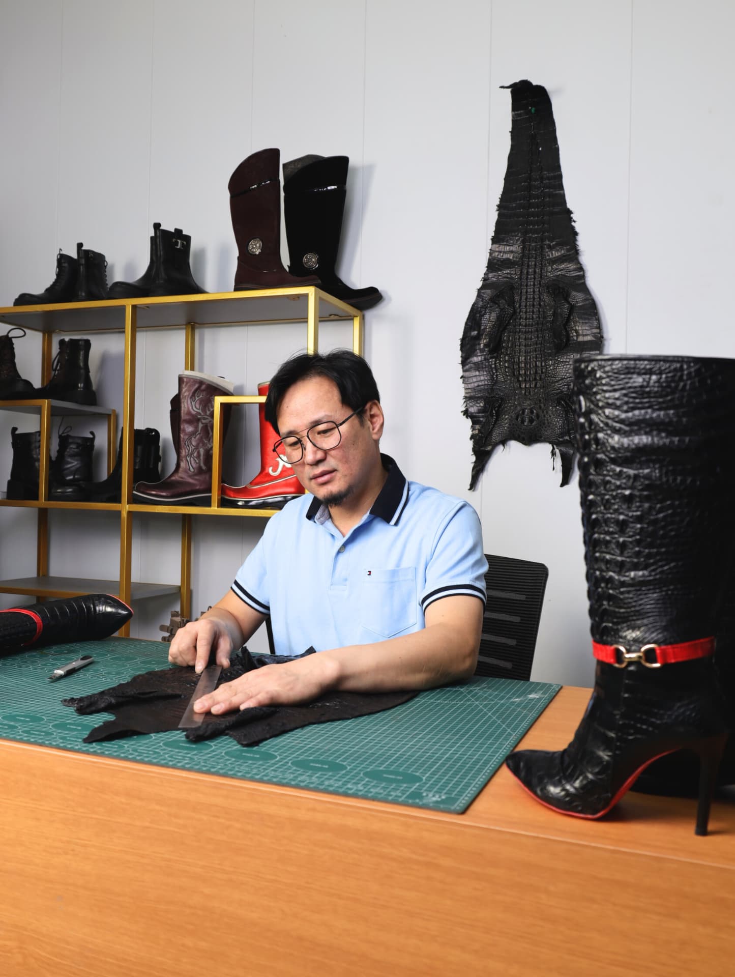 A SHAGAI craftsman stitching leather in our Ulaanbaatar atelier